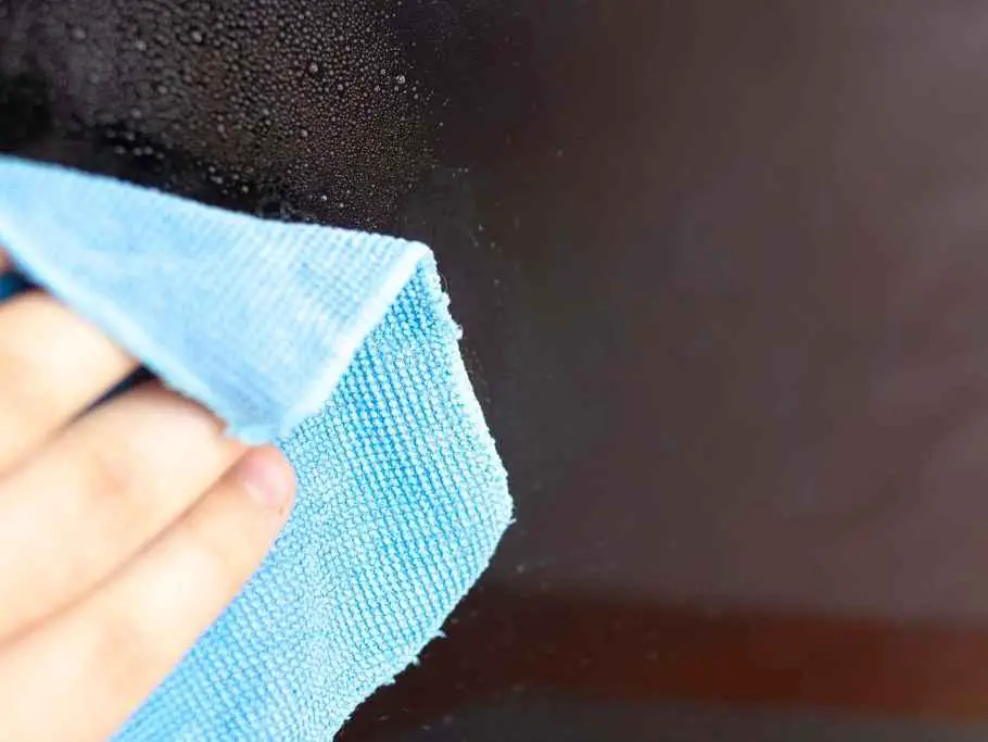 clean your laptop screen with damp microfiber cloth